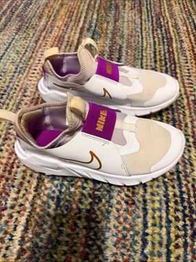 Nike Kids Slip-On Sneakers in Beige, White & Purple with Gold Swoosh